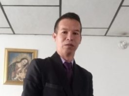 A person in a suit AI-generated content may be incorrect.